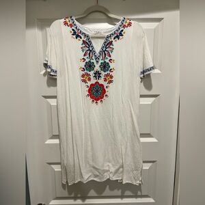 White dress with colorful embroidery